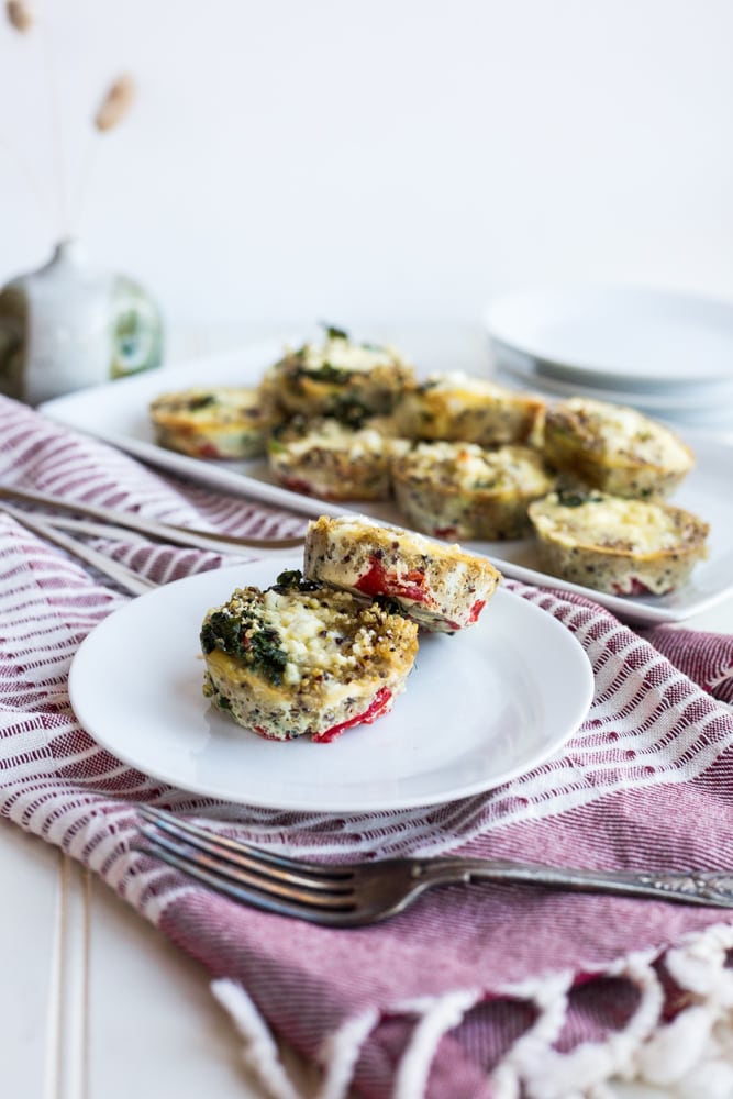 Two kale and goat cheese mini frittatas on a plate