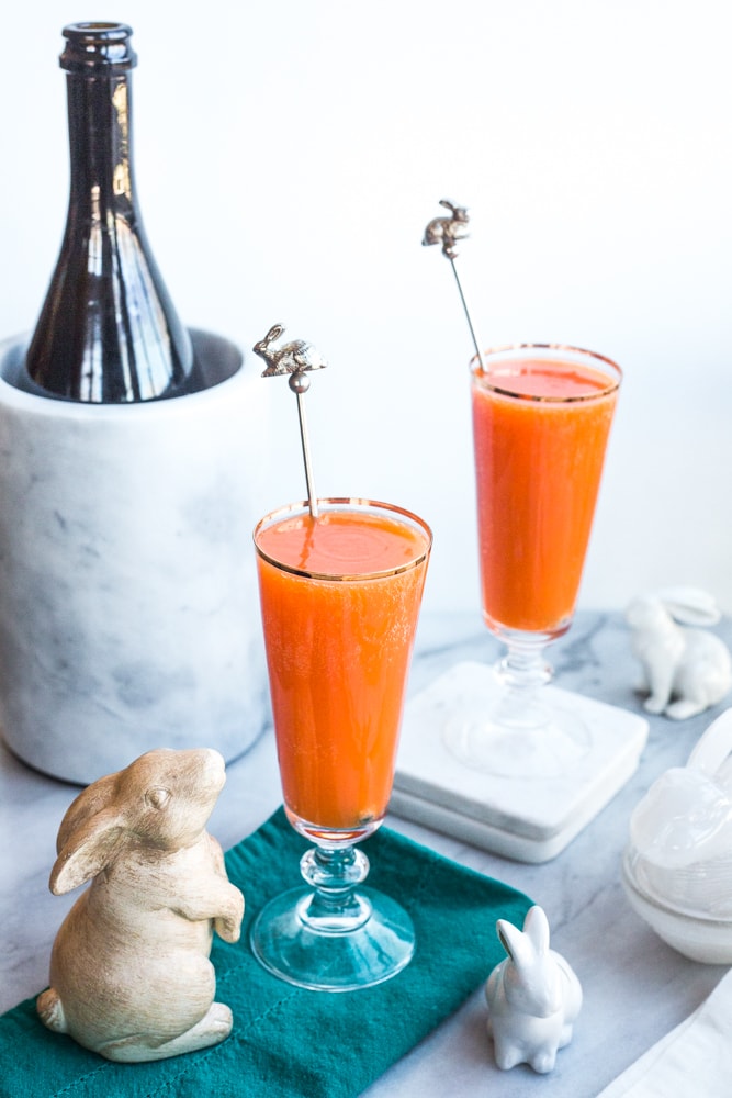 A carrot ginger mimosa surrounded by bunny figurines