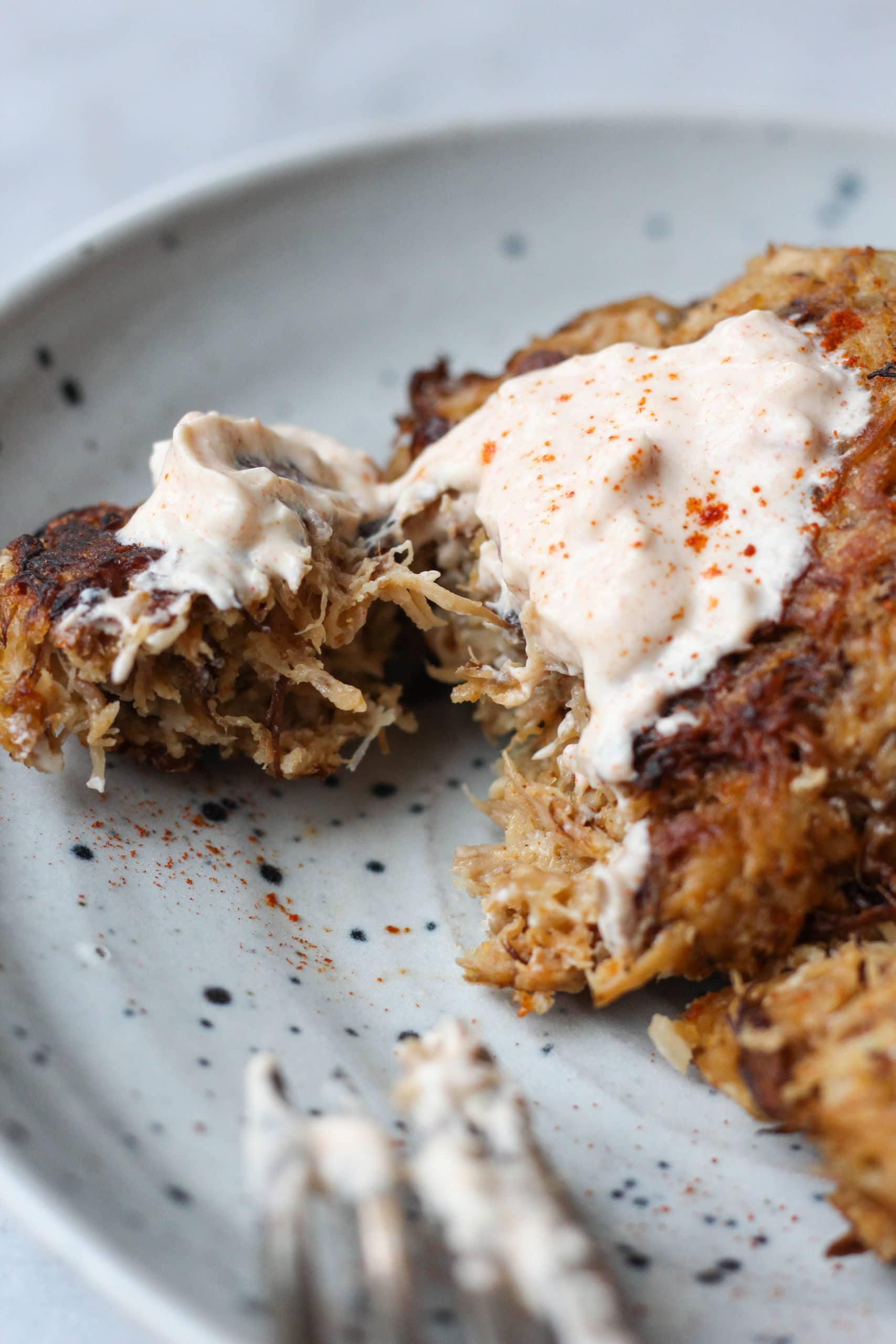 A platter of mushroom "crab" cakes topped with a remoulade sauce
