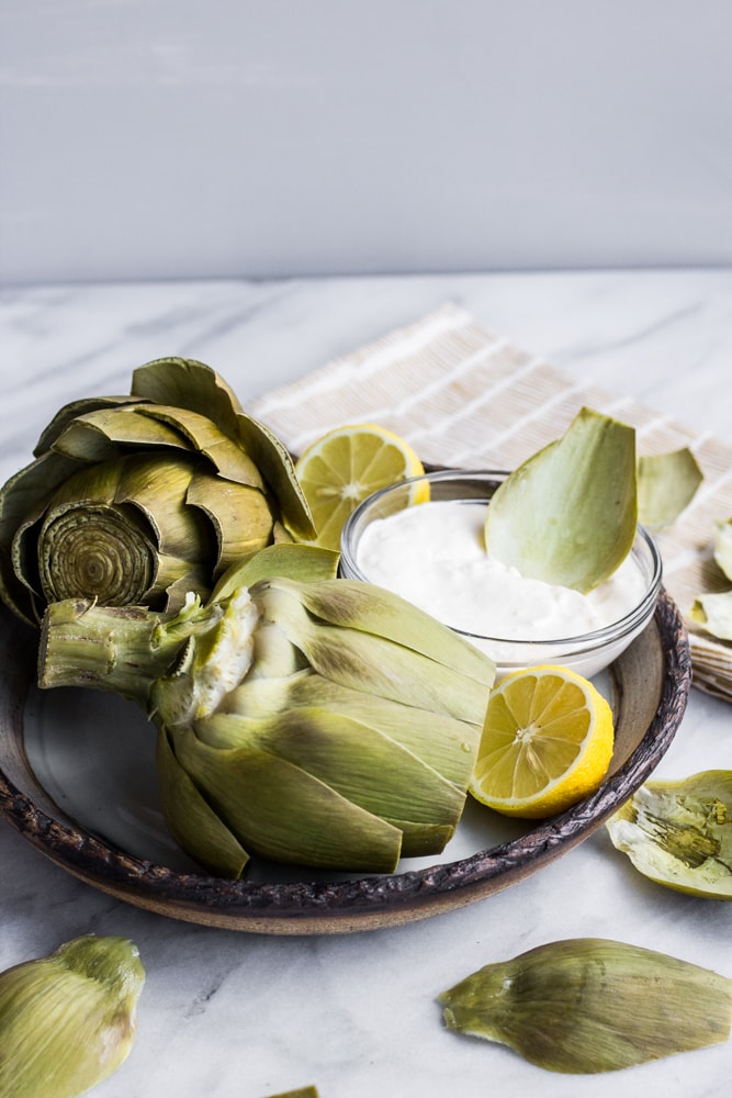 These Steamed Artichokes with Garlicky Aioli are delicious, fancy, and so simple. Seasoned lightly with lemon and dipped in an unbelievable aioli, this appetizer is a winner for all. 