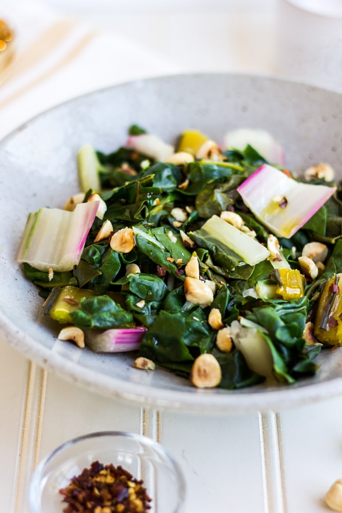 This Steamed Rainbow Chard with Toasted Hazelnuts is a delicious and healthy side dish! Chard is perfectly steamed and flavored with the help of a few secret ingredients.