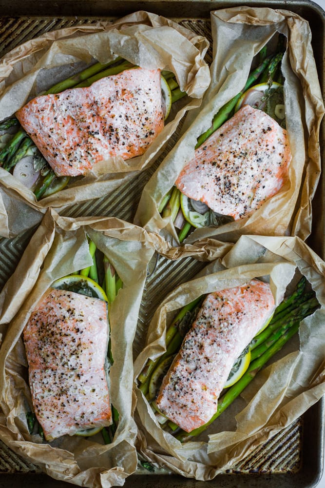 Four packets of salmon, asparagus, and lemon