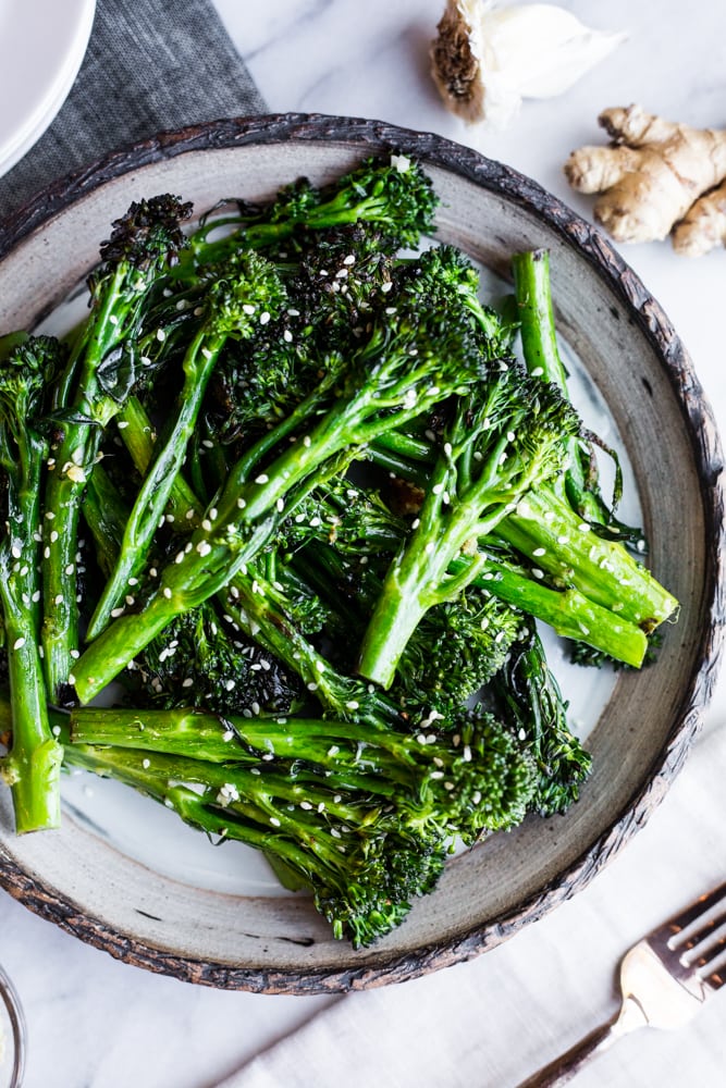 A plate of charred broccolini with sesame seeds