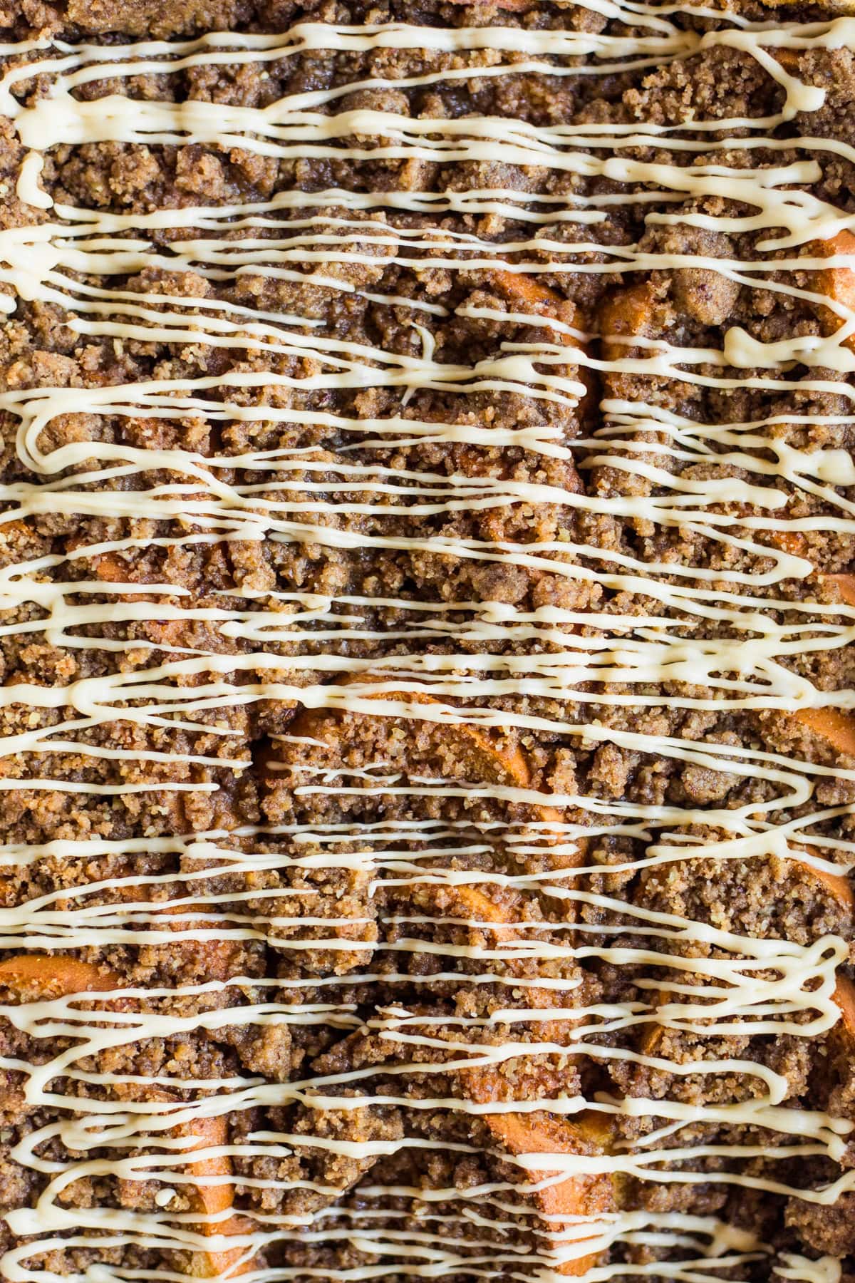 A close up view of pumpkin French toast bake topped with a maple glaze