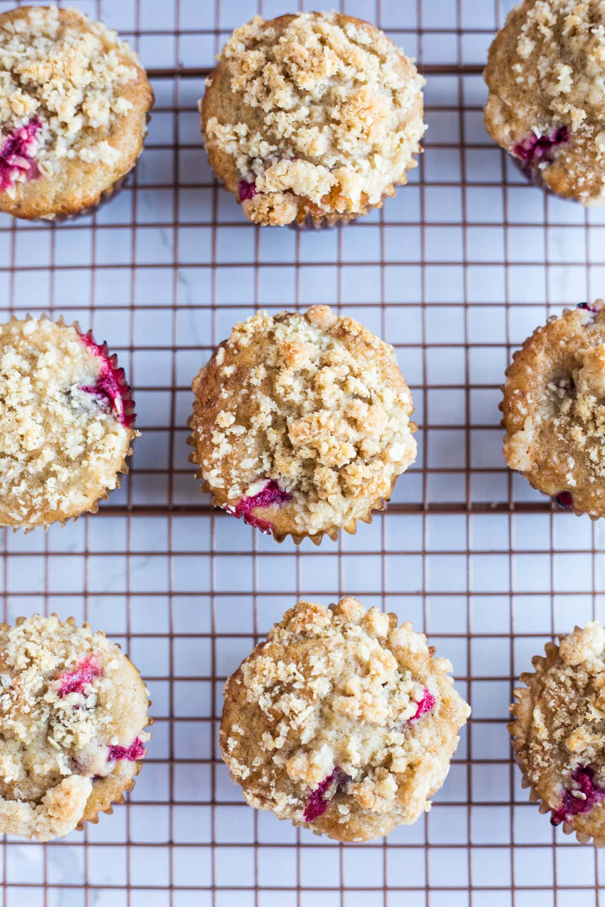 Cranberry streusel muffins on a cooling rack