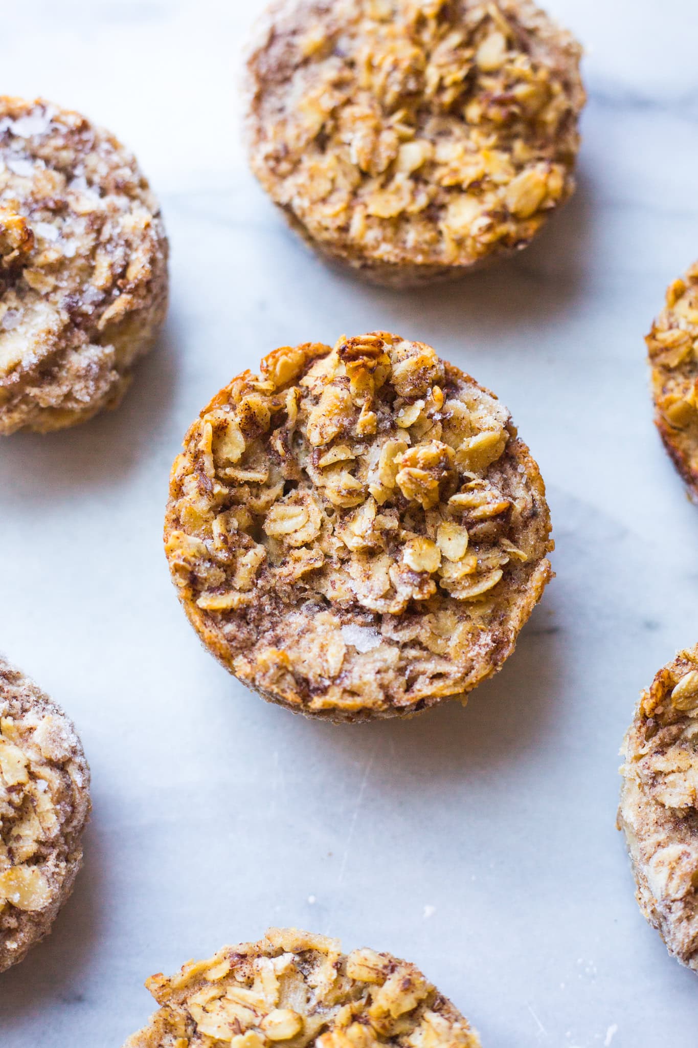A banana oat muffin on a marble slab