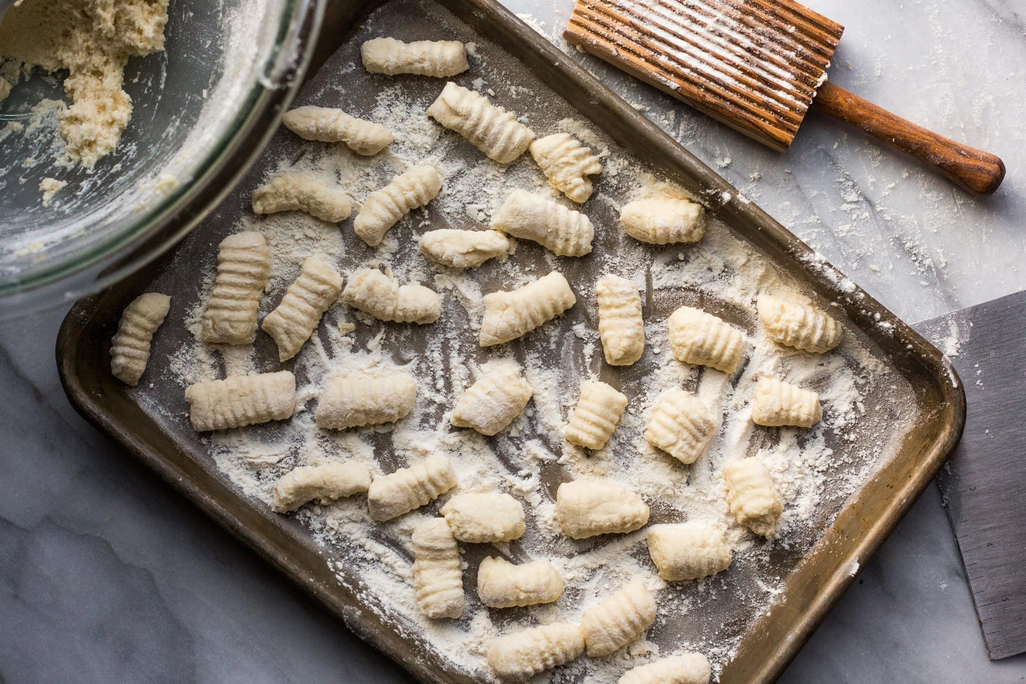 a baking sheet topped with ricotta gnocchi