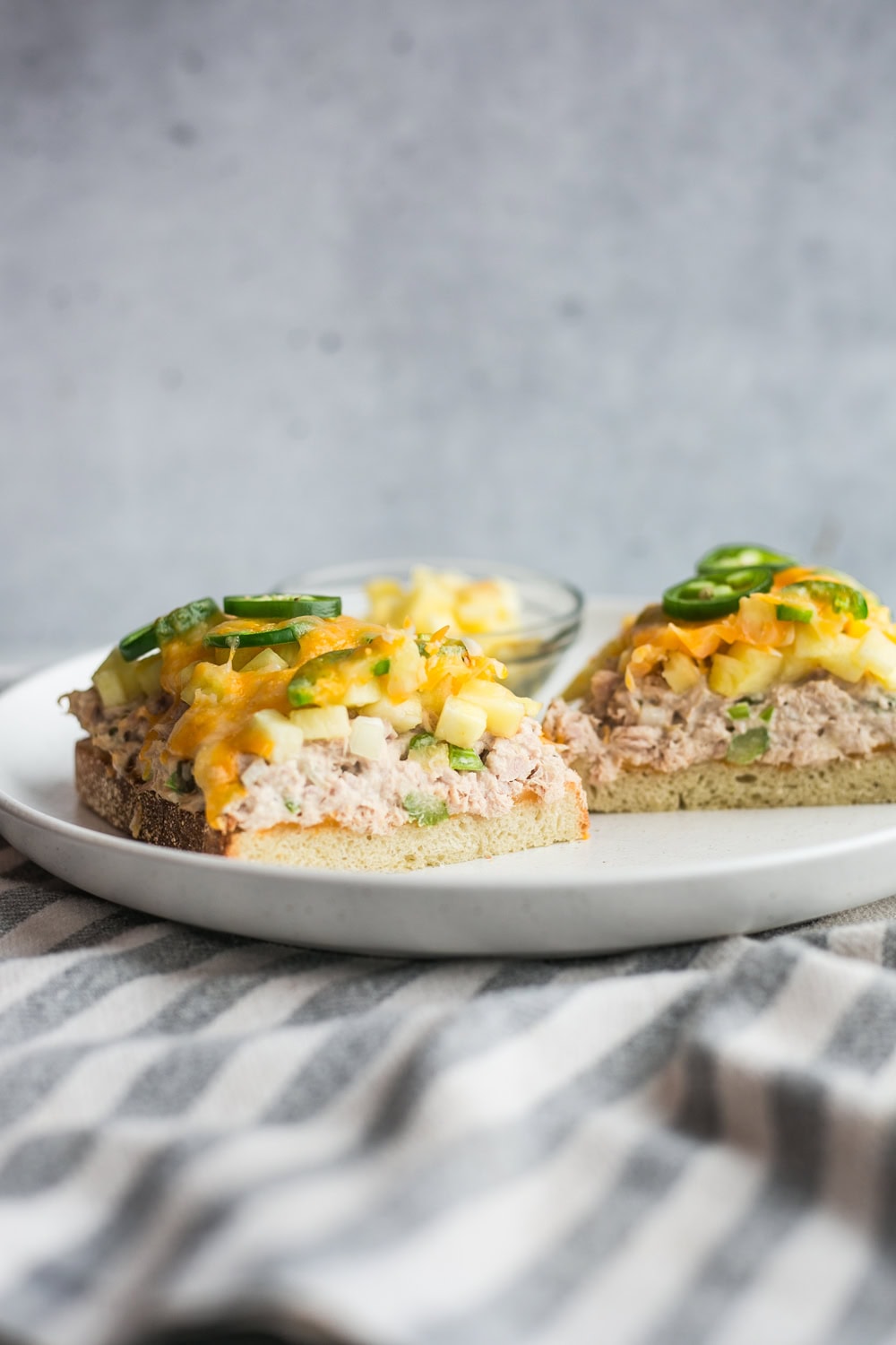 A tuna melt with pineapple and jalapeño topped with melted cheese
